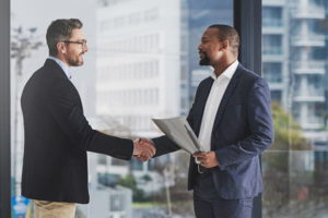 two businessmen shake hands