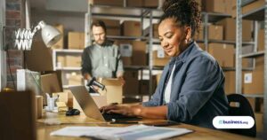 two people working packaging orders in small warehouse